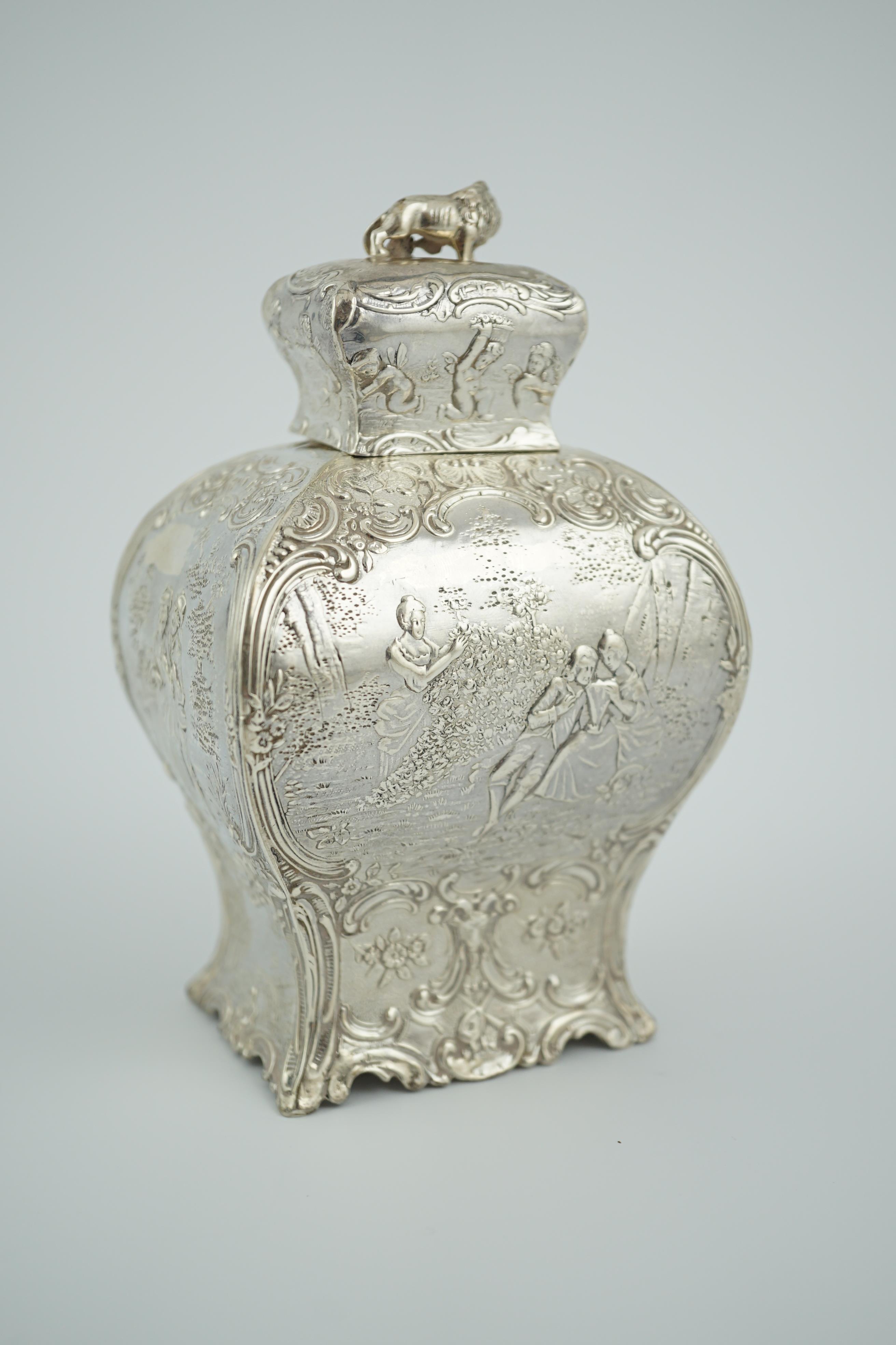 A late 19th century Hanau embossed silver bombé shaped tea caddy and cover